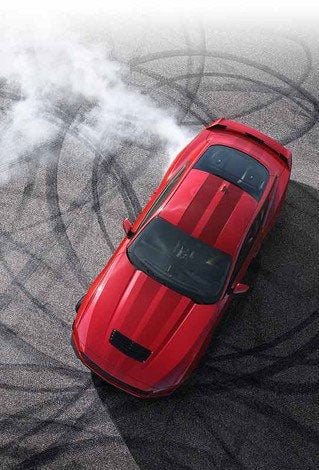 Overhead view of a 2024 Ford Mustang® model with tire tracks on pavement | Griffin Ford Fort Atkinson in Fort Atkinson WI